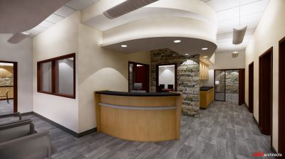 Lobby area of office with front desk and stone on walls as accent.