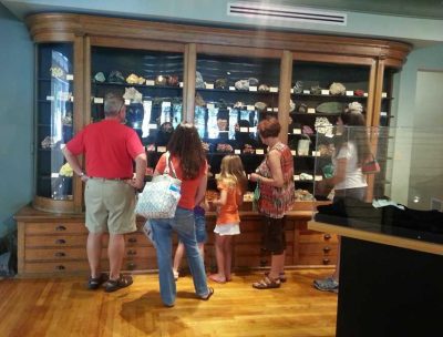 Visitors view the Gillespie Museum's rock and mineral collections.