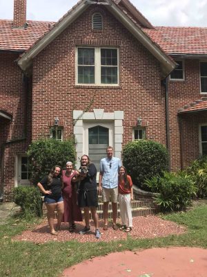 A group shot in front of the house