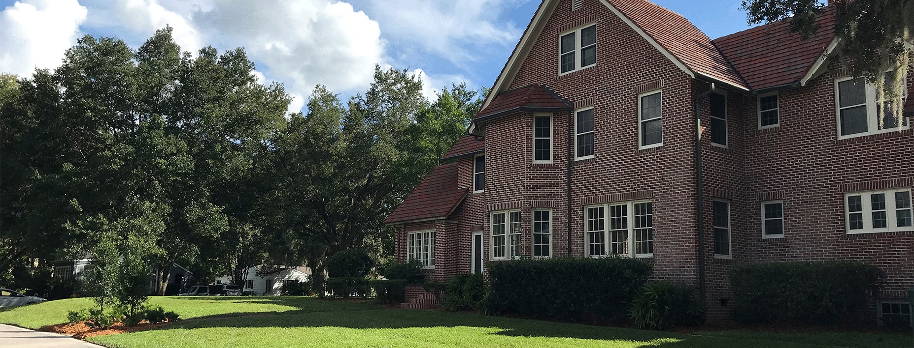 Exterior of two-story brick house on campus for the Stetson Hillel House.