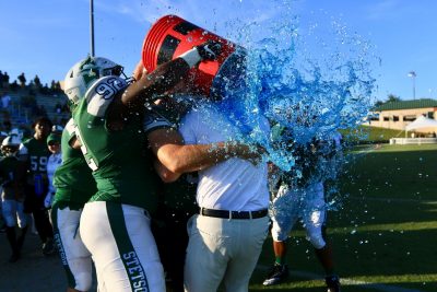 Players dump cooler of ice water on the coach