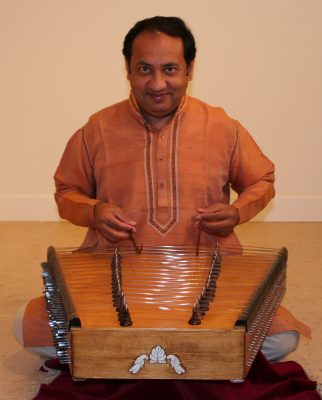 Indian musician and adjunct professor "Nandu" Muley sits at a santoor