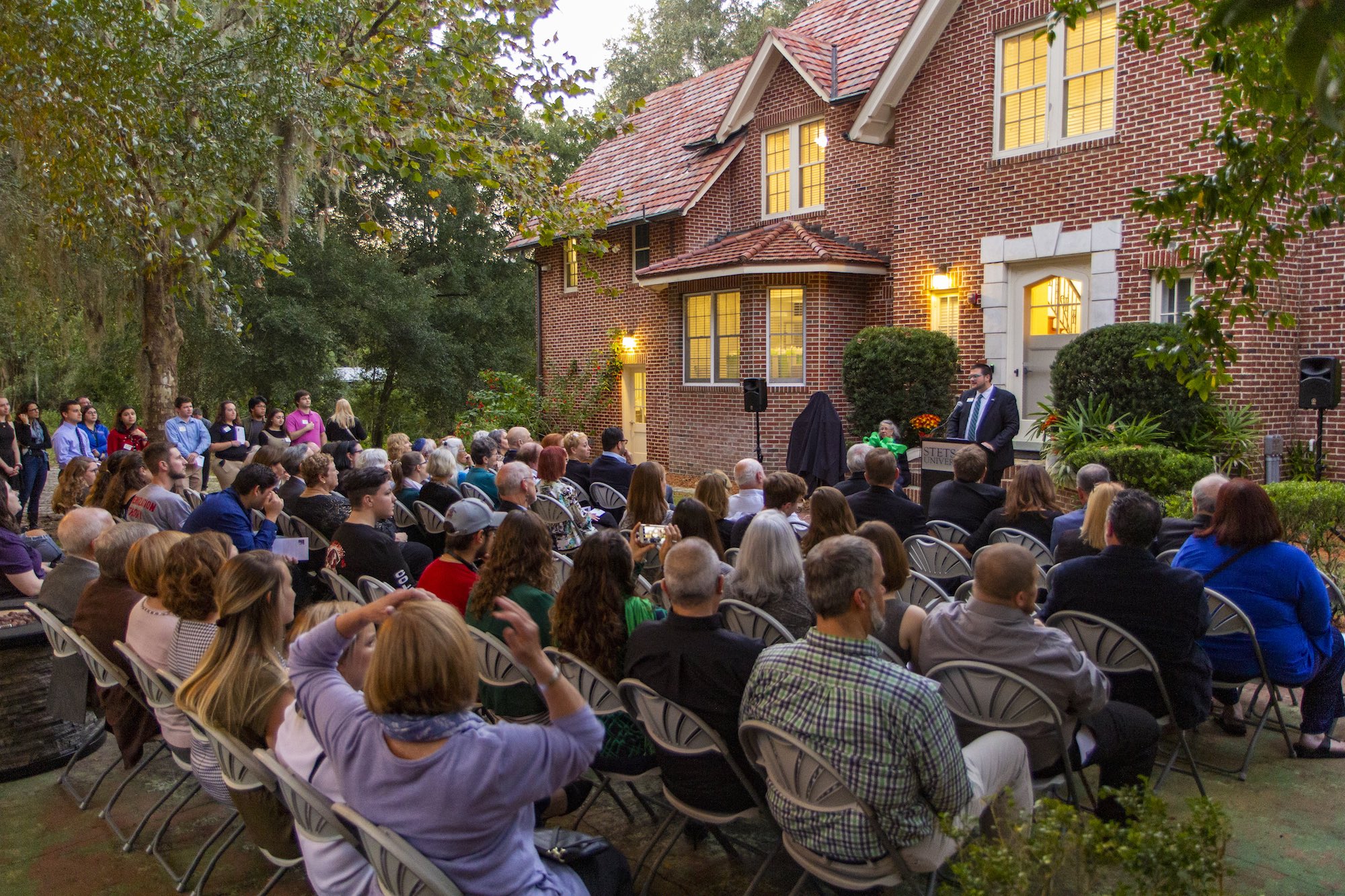 a crowd seated out the Stetson Hillel House