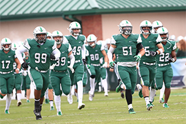 Hatters Football team runs out on the field