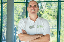 portrait with windows behind him