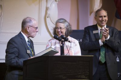 The three stand near the podium after the proclamation is read.