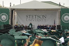 Graduates are seated and facing the graduation platform