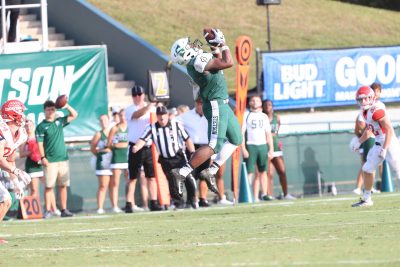 Jeremiah Nails makes a leaping catch for the football during a game.