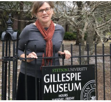 Karen Cole stands in front of sign that says Gillespie Museum, which will host Science Cafe