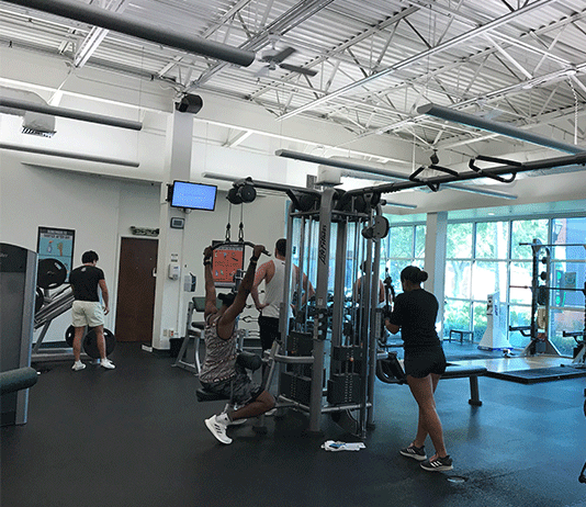 Students work out in the Hollis Center fitness facility