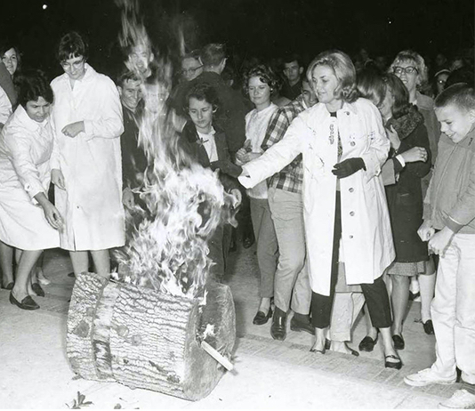 Students gather around the burning Yule Log during the Yule Log Lighting ceremony.