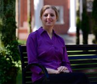 portrait on a bench in Palm Court