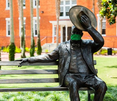John B. Stetson statue wears a mask as Stetson answers questions about isolation