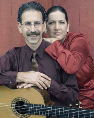 portrait with him holding a guitar