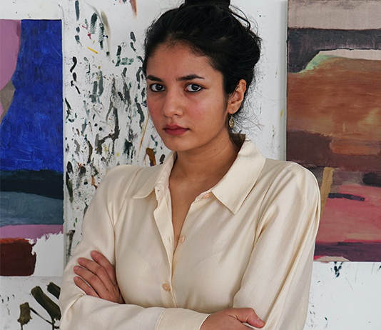 portrait with her artwork