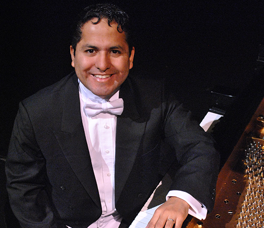 portrait in a tuxedo at a piano