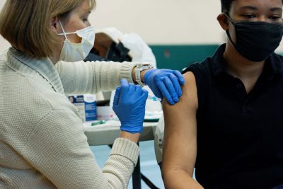 a student gets a COVID-19 vaccine