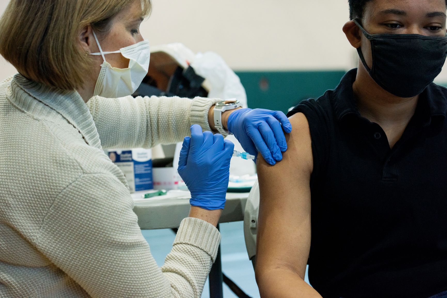 a student gets a COVID-19 vaccine, for 2021 Year in Review