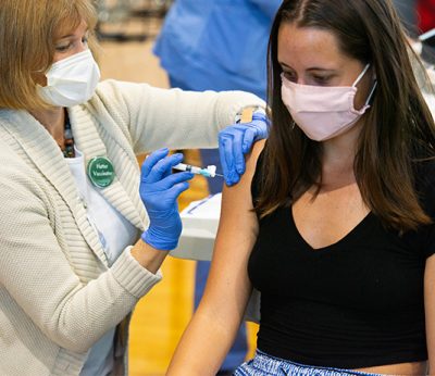 Female student receives a vaccine