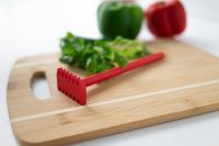 a cutting board with herbs and The Herbtastic 