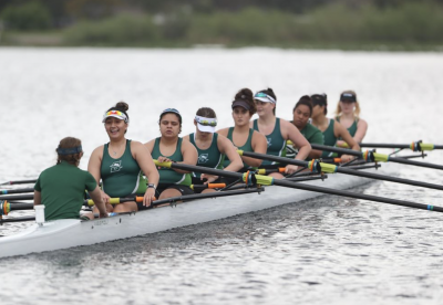 Women's rowing team takes a break at the meet.