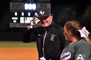 Frank Griffin is smiling on the softball field.