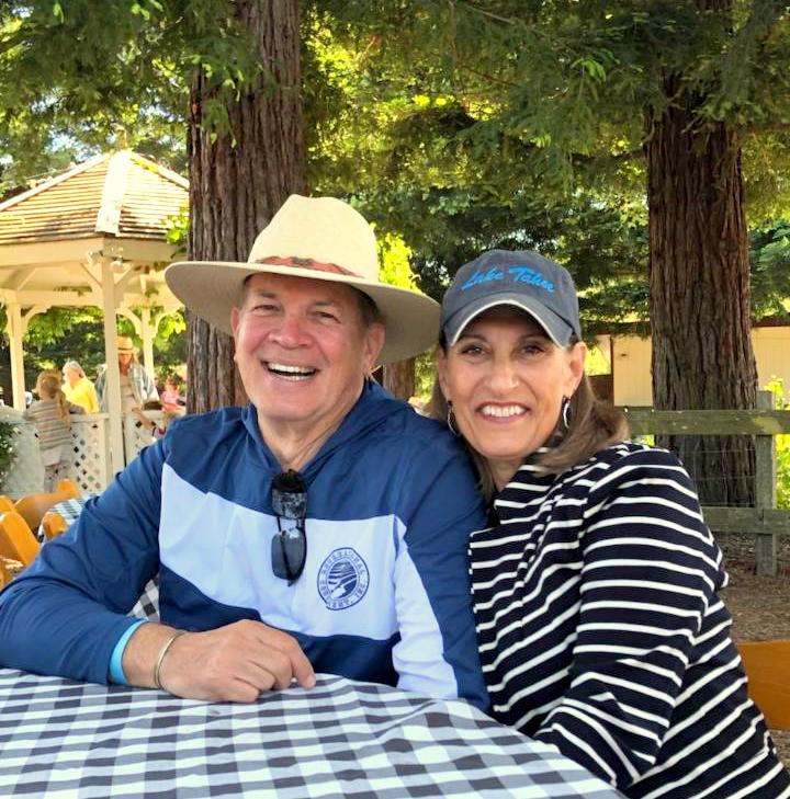 Scott Boore and wife Eileen sit at a picnic table.