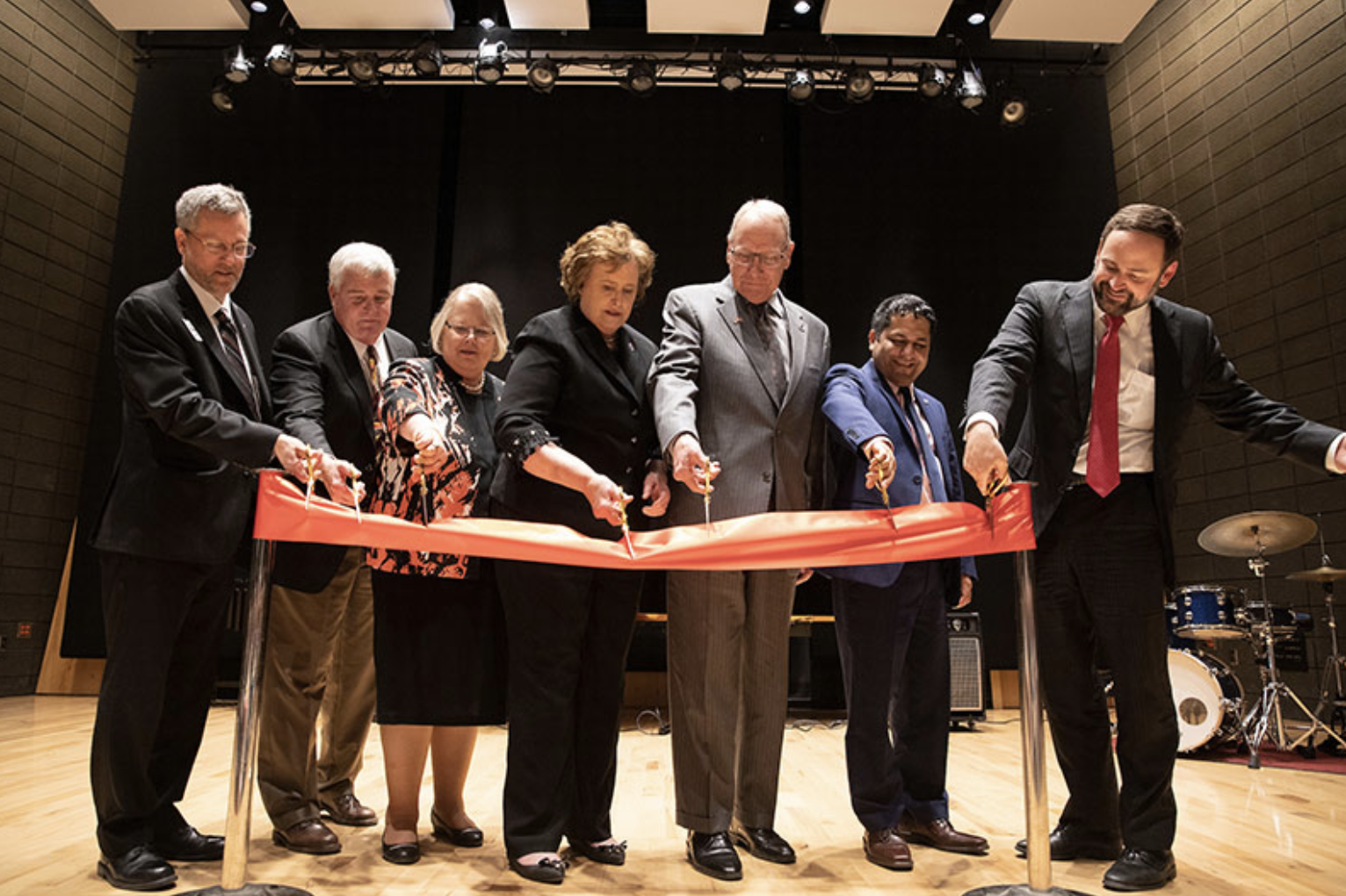 Washington Garcia and others cut the ribbon on renovations and additions to a performing arts center at University of Nebraska Omaha