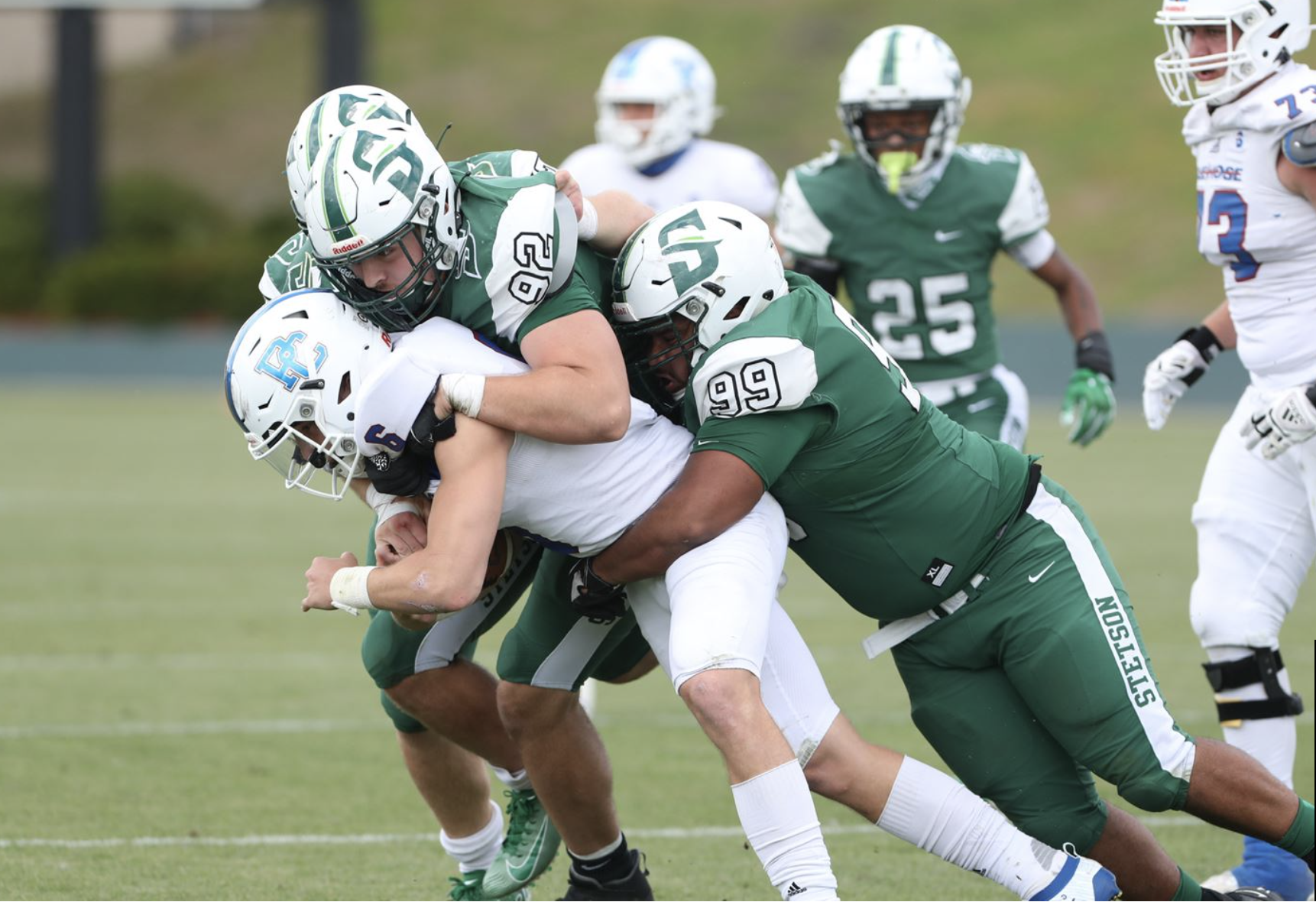 Hatters make a tackle during a football game