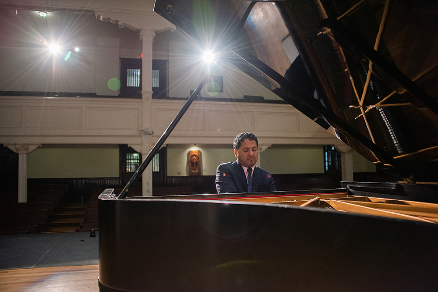 Washington Garcia plays in a grand piano in Lee Chapel.