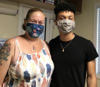 First-year student Gabriel Santos and his mother take a break as Stetson welcomes new and returning students