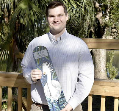 portrait holding his award