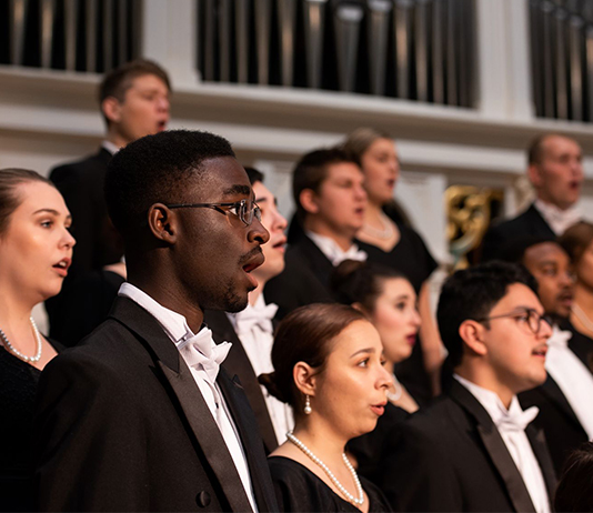 Choir members sing in the Christmas concert