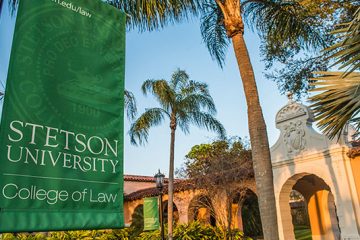 A Stetson College of Law banner hangs in front of the college.