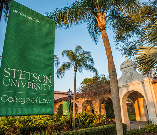 A Stetson College of Law banner hangs in front of the college.