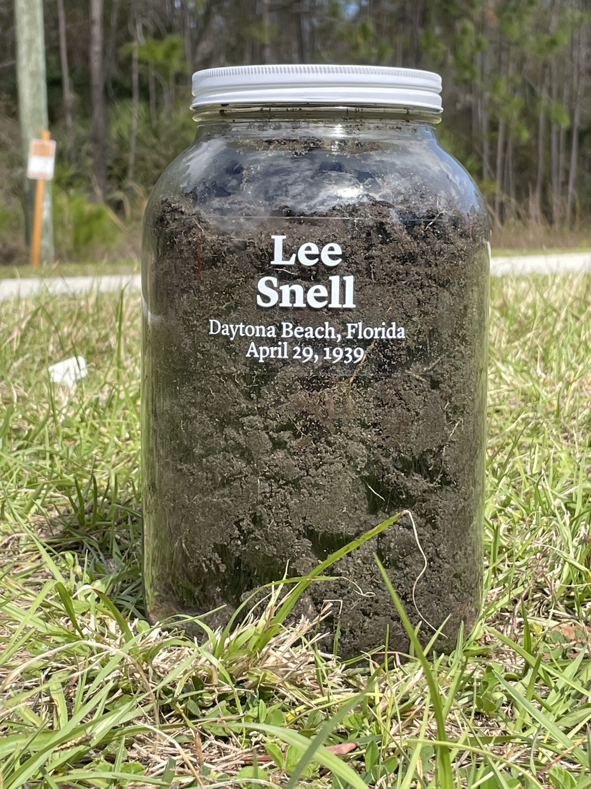 A mason jar with soil from the lynching site outside Daytona and the name of the victim, Lee Snell