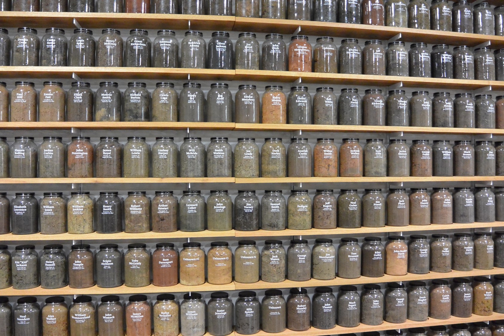 a display of soil samples in mason jars from lynching sites across America