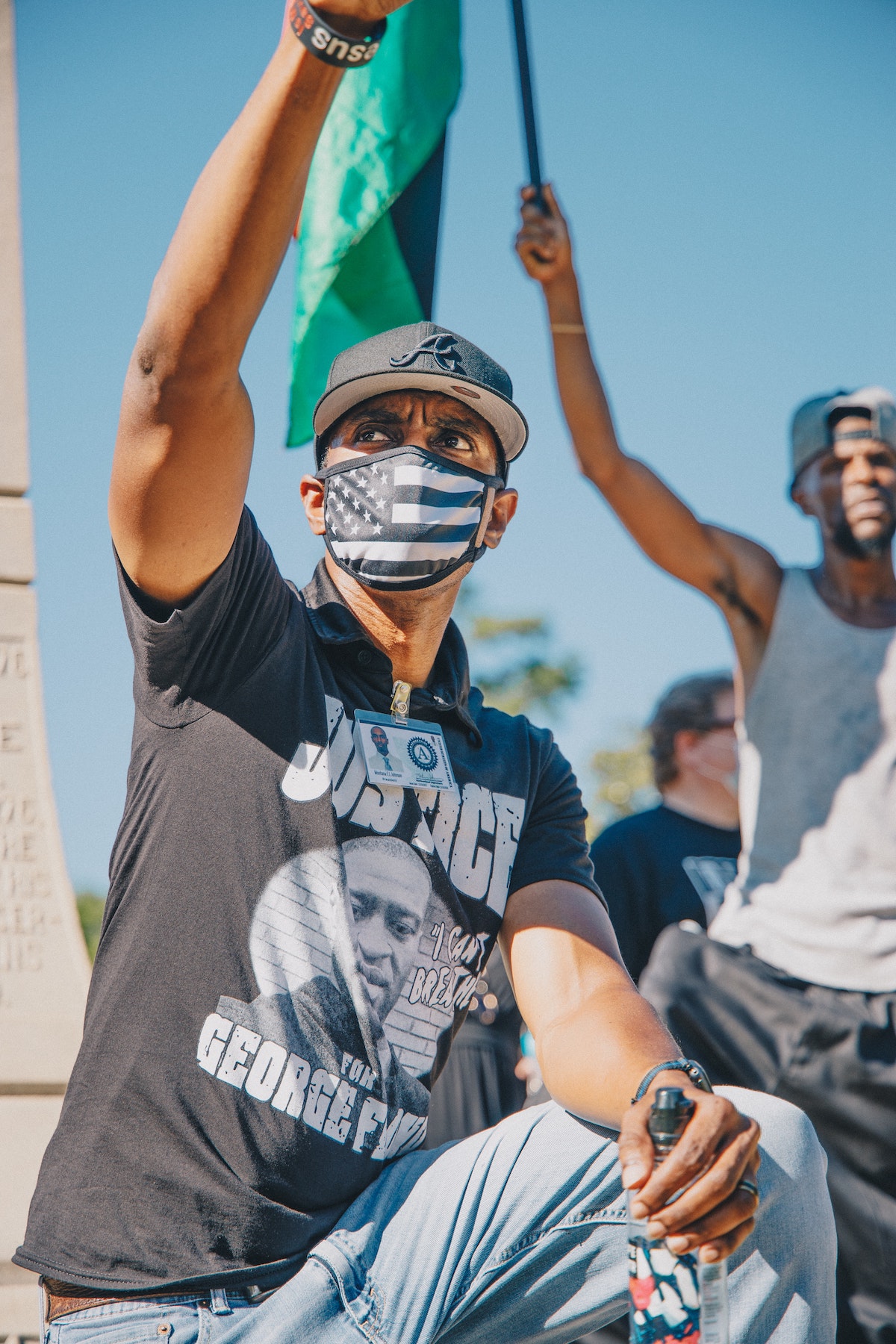 A protester lifts his fist for George Floyd