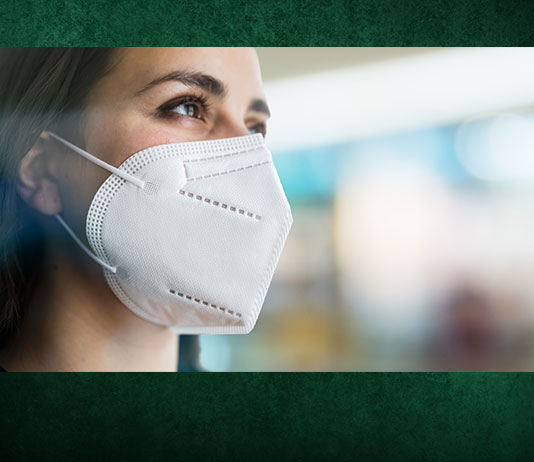 A woman wears a respirator to protect against COVID-19.