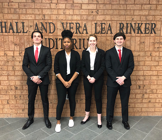 group photo of four students on ethics team.