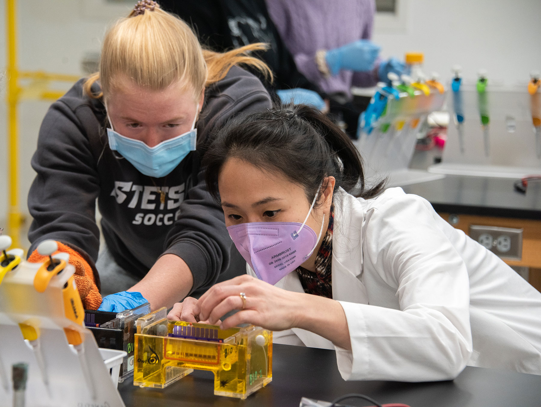 Dr. Lynn Kee works with a student and a DNA sample in Sage Hall in a class that will teach gene editing.