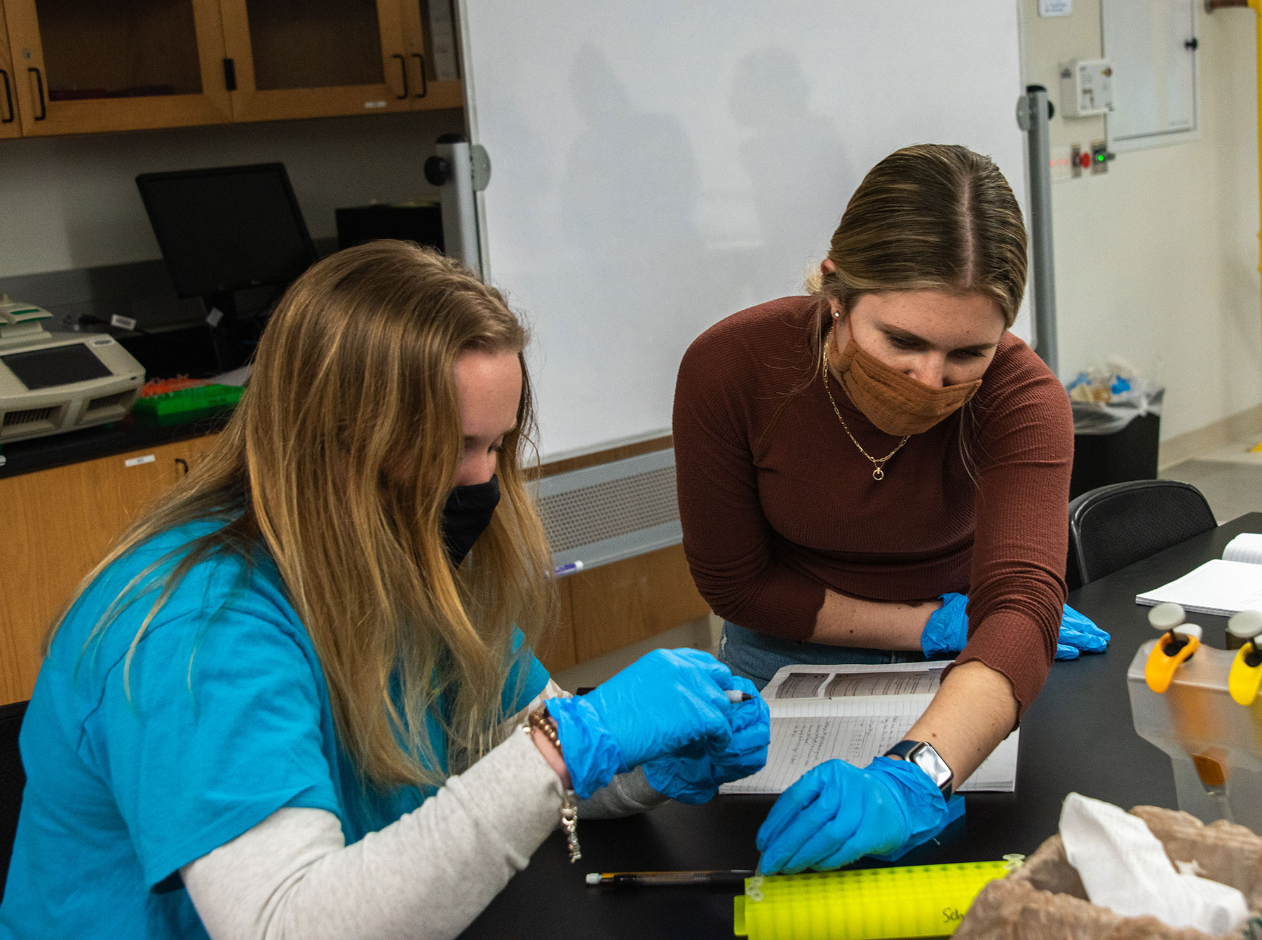 Two students work in a Sage Hall science lab.