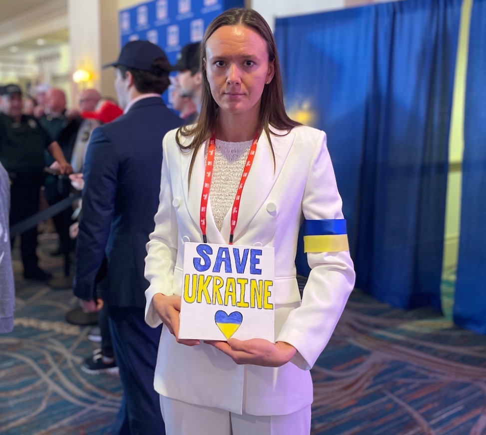 portrait of her holding Save Ukraine sign