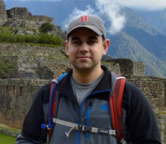 portrait outdoors at ancient ruins of scientist who will give talk for Science Cafe