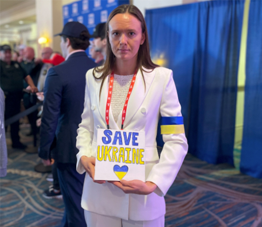 Portrait with sign, Save Ukraine