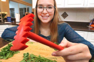 Kendall Buck holds her product in the kitchen.