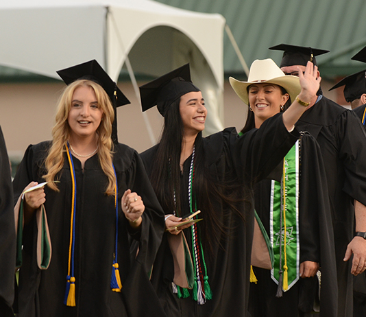 Graduates line up at Commencement 2022