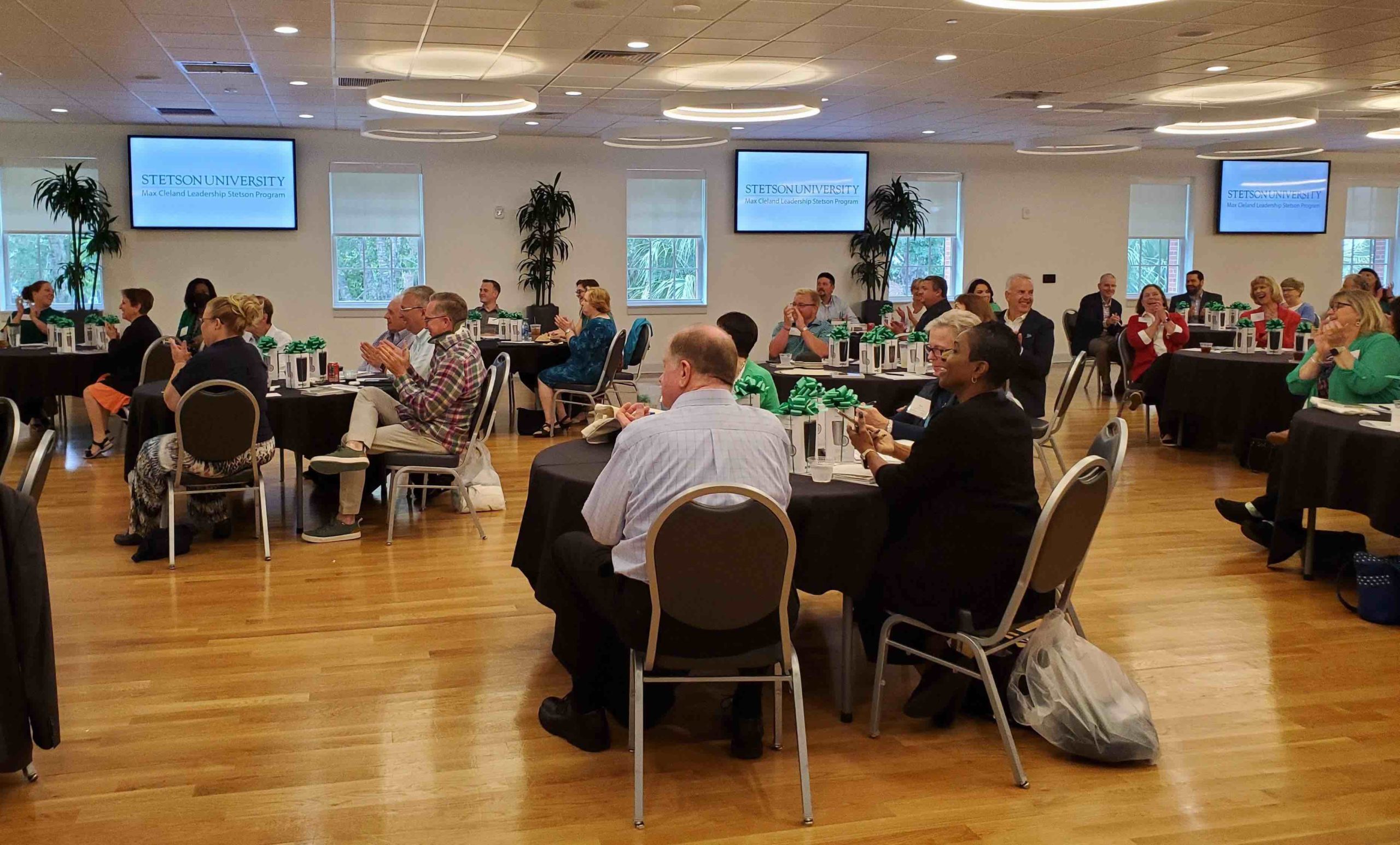 Alumni sit at tables in the Stetson Room during Leadership Stetson