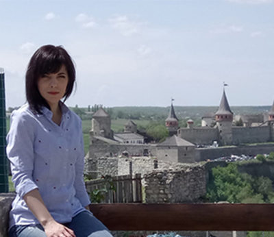 Professor seated outdoors in Ukraine