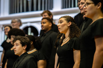 Choir members sing in Lee Chapel